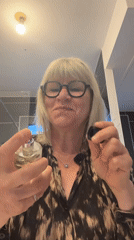 Woman applies perfume in early morning Chambœuf