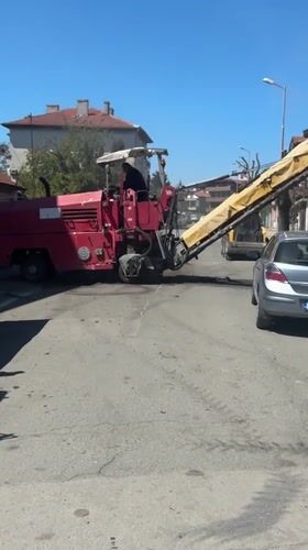 Road repair crew works residential streets in Tsarevo, Bulgaria