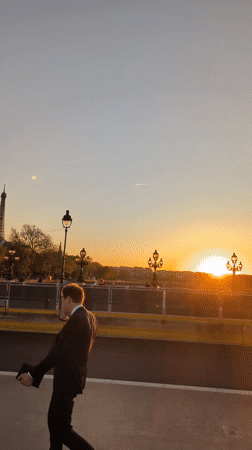 Tourist captures Seine River views, Eiffel Tower during Paris evening