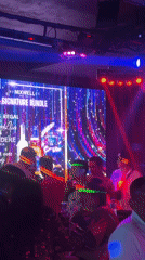 Kuta nightclub bustling with socializing patrons and dancing