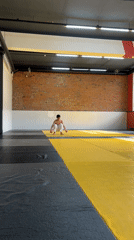 Young man practices martial arts in Krasnoyarsk gym