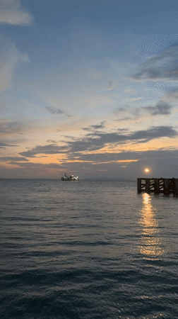 Dancing on a Ko Samui pier at sunset