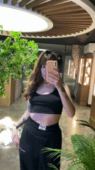 Woman takes multiple selfies in Votkinsk shops and interiors