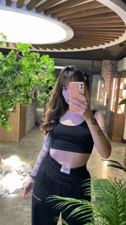 Woman takes multiple selfies in Votkinsk shops and interiors