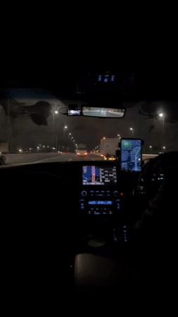 Driver records nighttime highway view from dashboard in Ota City