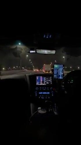 Driver records nighttime highway view from dashboard in Ota City