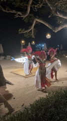 Traditional dance and fire juggling on a Bali beach at night