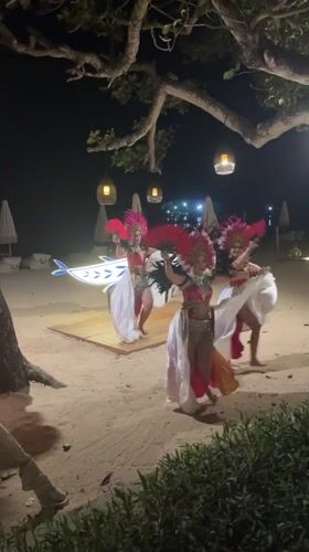 Traditional dance and fire juggling on a Bali beach at night
