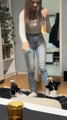 Woman plays with dogs in Sofia apartment