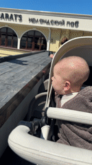 Family enjoys sunny outdoor dining experience in Sochi restaurant