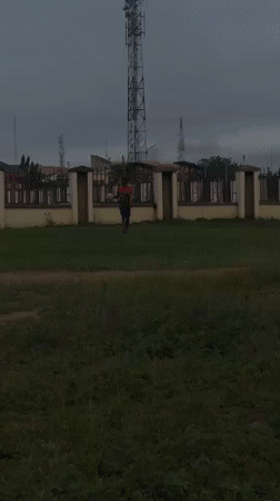 Young men play casual soccer in Ihiagwa, Nigeria