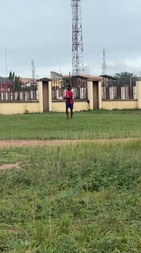 Young men play casual soccer in Ihiagwa, Nigeria