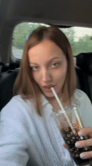 Woman travels through Reshetnikovo, drinks and applies skincare