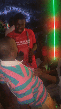 Night party scene in Kurunduma, indoors and out