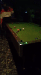 Pool game captured at LED-lit lounge in Lokoja, Nigeria