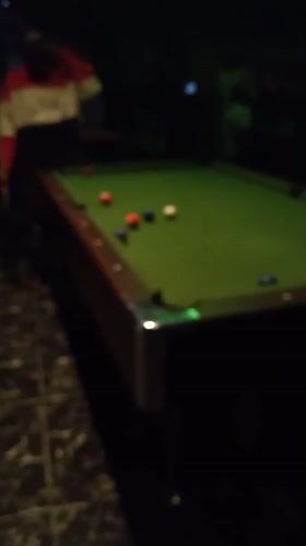 Pool game captured at LED-lit lounge in Lokoja, Nigeria