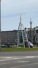 Luxury cars spotted near public art in Belarus village