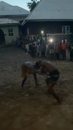 Traditional wrestling match draws spectators in rural Nigerian village