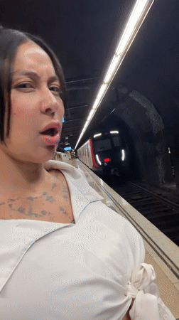 Woman boards Barcelona subway, makes playful gesture inside train