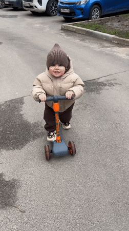 Toddler enjoys scooter ride and family time in Klin