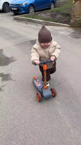 Toddler enjoys scooter ride and family time in Klin