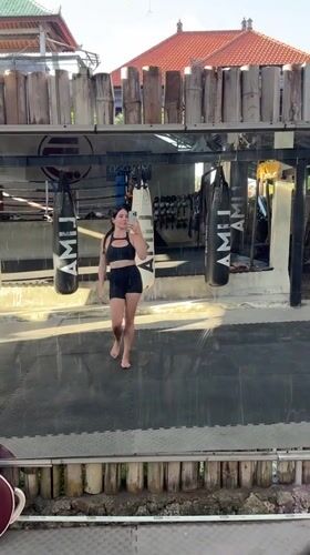 Mirror selfies and a leashed dog at a Bali Muay Thai gym