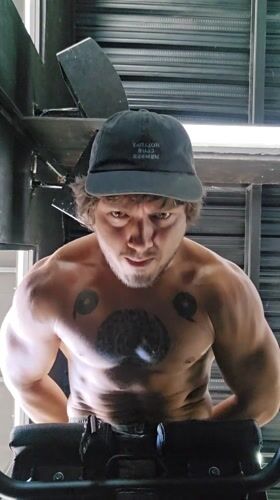 Man exercises with bench routine in Dalung, Indonesia