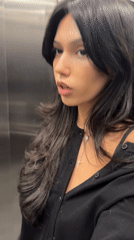 Woman shows surprise in elevator, Rosario Argentina