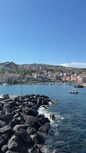 Coastal views captured in Aci Castello, Sicily on sunny afternoon