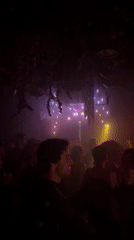 Nightclub scene captured in multicolored lights in New York