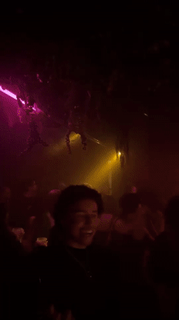 Nightclub scene captured in multicolored lights in New York
