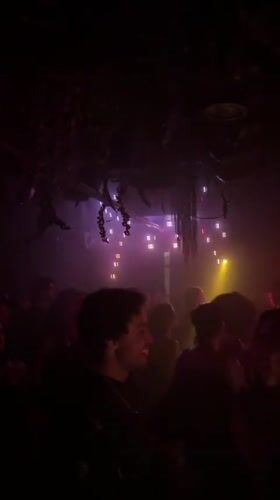 Nightclub scene captured in multicolored lights in New York
