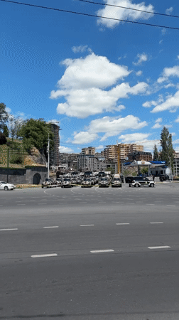 Black vehicles cordoned with police tape in Yerevan