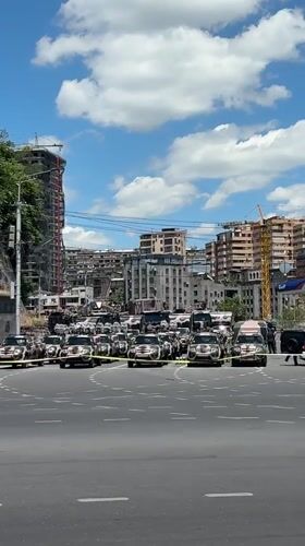 Black vehicles cordoned with police tape in Yerevan
