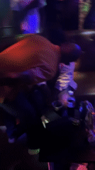 Evening social gathering at Jos nightclub with dancing, soccer viewing