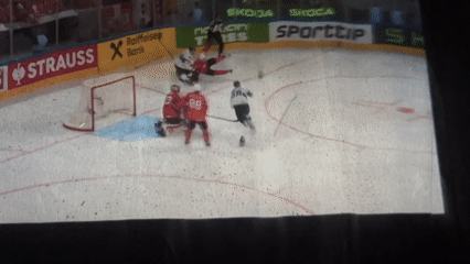 Hockey game projected on makeshift screen in Sochi room