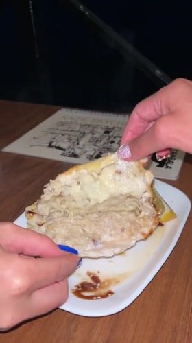 Cheesy stuffed pastries and sauced pie at a Nagornyy table