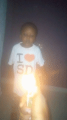 Child observed in dark room with lighter present