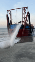 Ship beached and pumping water on Đà Nẵng shore