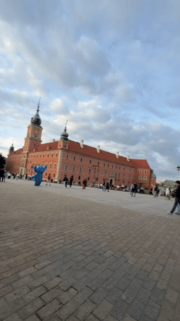 Crowds fill Warsaw's Old Town Market Place on a summer evening