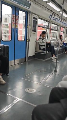 Transit rider documents subway journey, city skyline in Chongqing