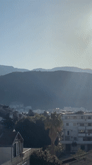 Morning moments captured in Budva's mountainous coastal cityscape