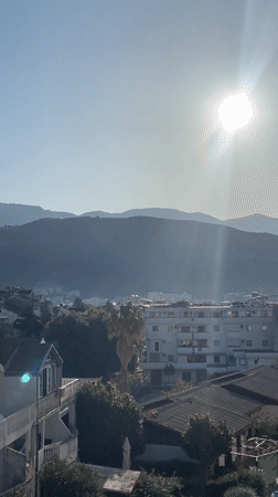 Morning moments captured in Budva's mountainous coastal cityscape