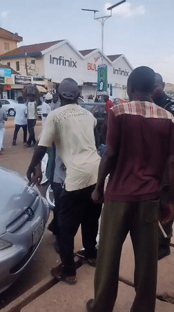 Daytime street scene with pedestrians captured in urban area