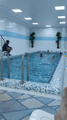 Kids swimming at an indoor pool in Noviy, Russia