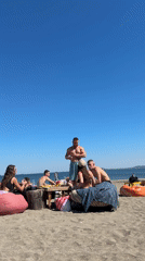 Beachgoers gather for sunny afternoon socializing in Burgas