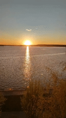 Sunset captured over water in Votkinsk, Russia