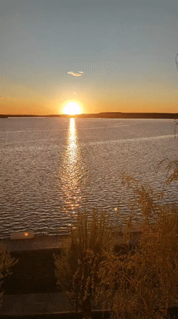 Sunset captured over water in Votkinsk, Russia