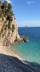 Tourists explore coastal caves and tunnels at Montenegro beach