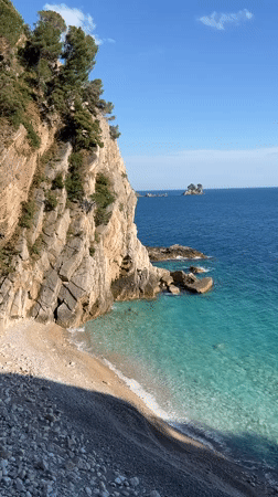 Tourists explore coastal caves and tunnels at Montenegro beach